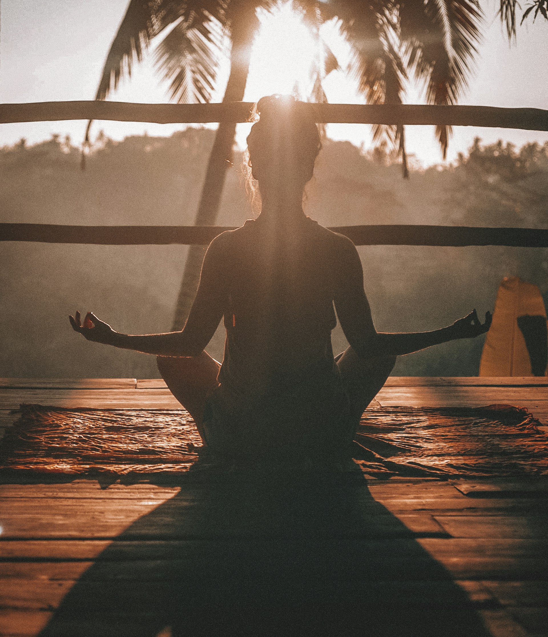 Person meditating in a calm, sunlit space